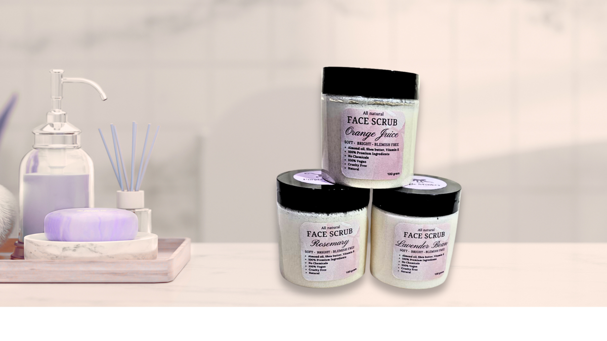 all 3 flavors of face scrub jars stacked in a bathroom setting